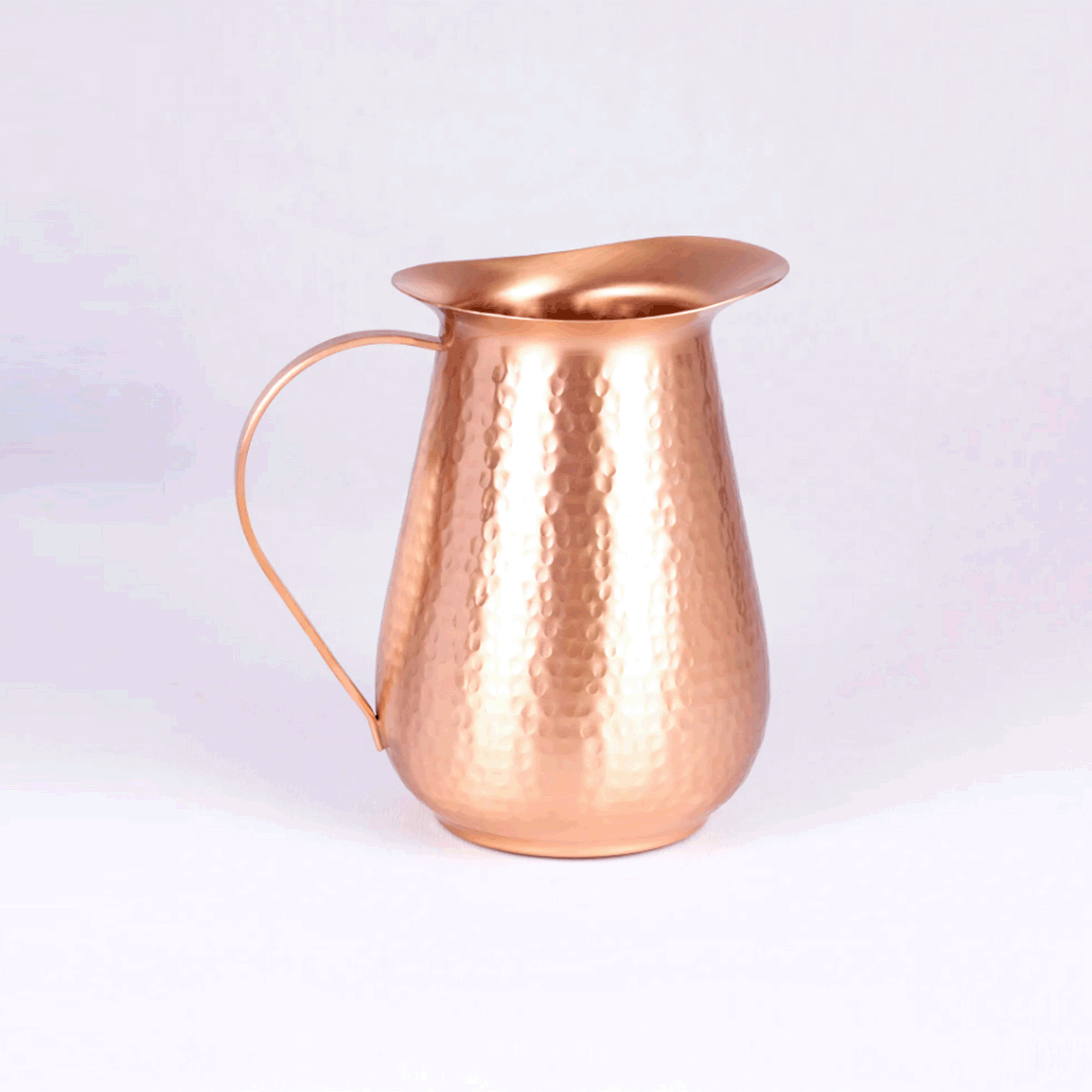 pure copper water jug with hammered design.